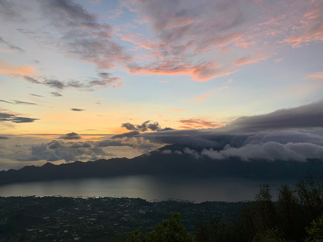 Sunrise over the caldera and lake seen from the summit of Mount Batur, Bali