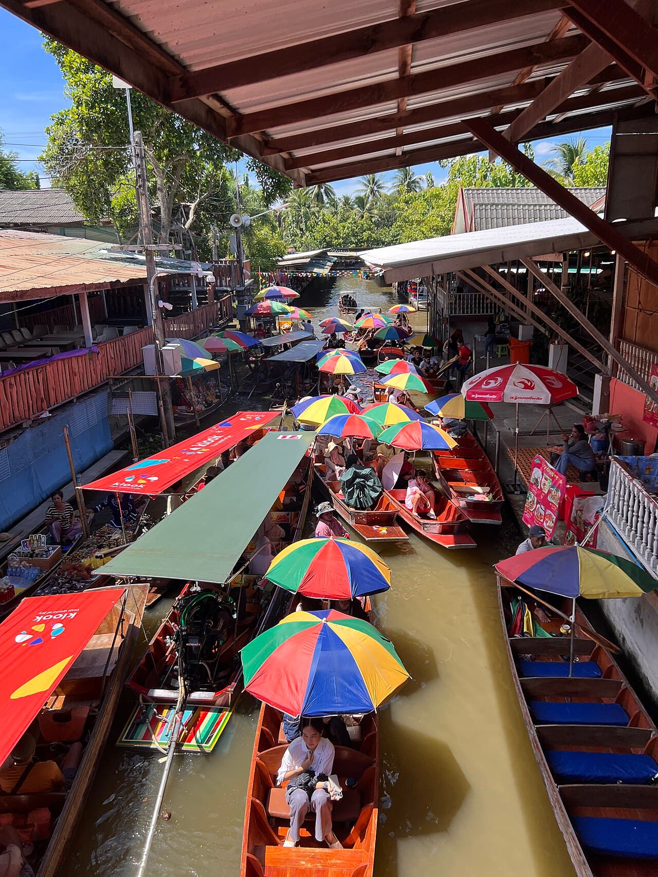 Wooden boats loaded with fruit and produce at a floating market near Bangkok