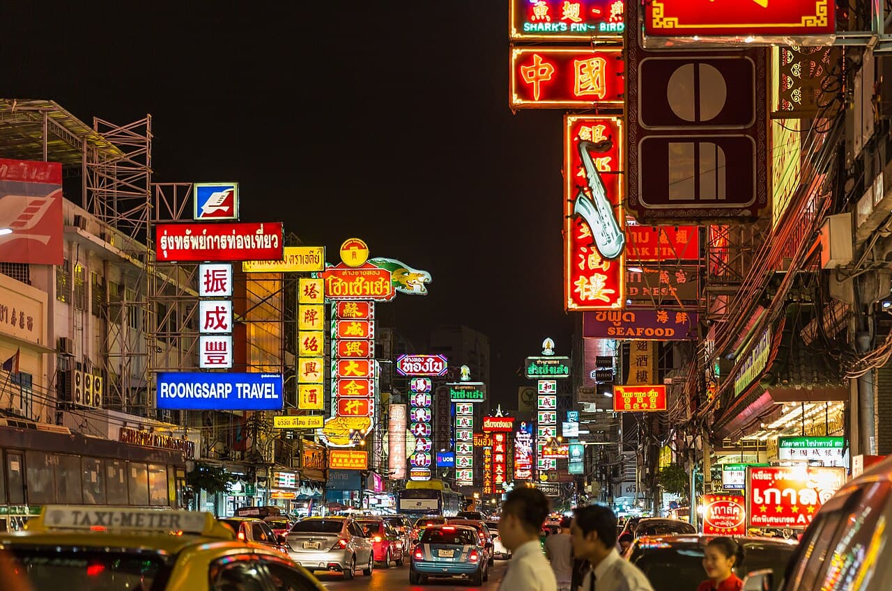 Neon signs and crowds along Yaowarat Road in Bangkok's Chinatown at night