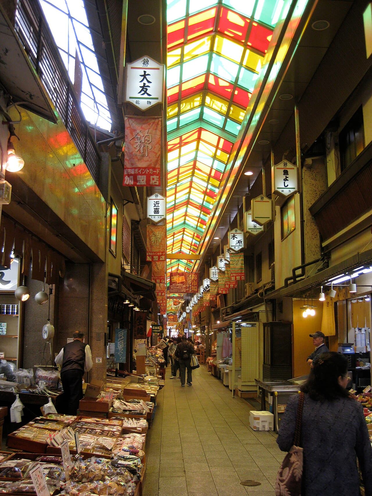 Stalls of food and produce lining the covered Nishiki Market arcade, Kyoto