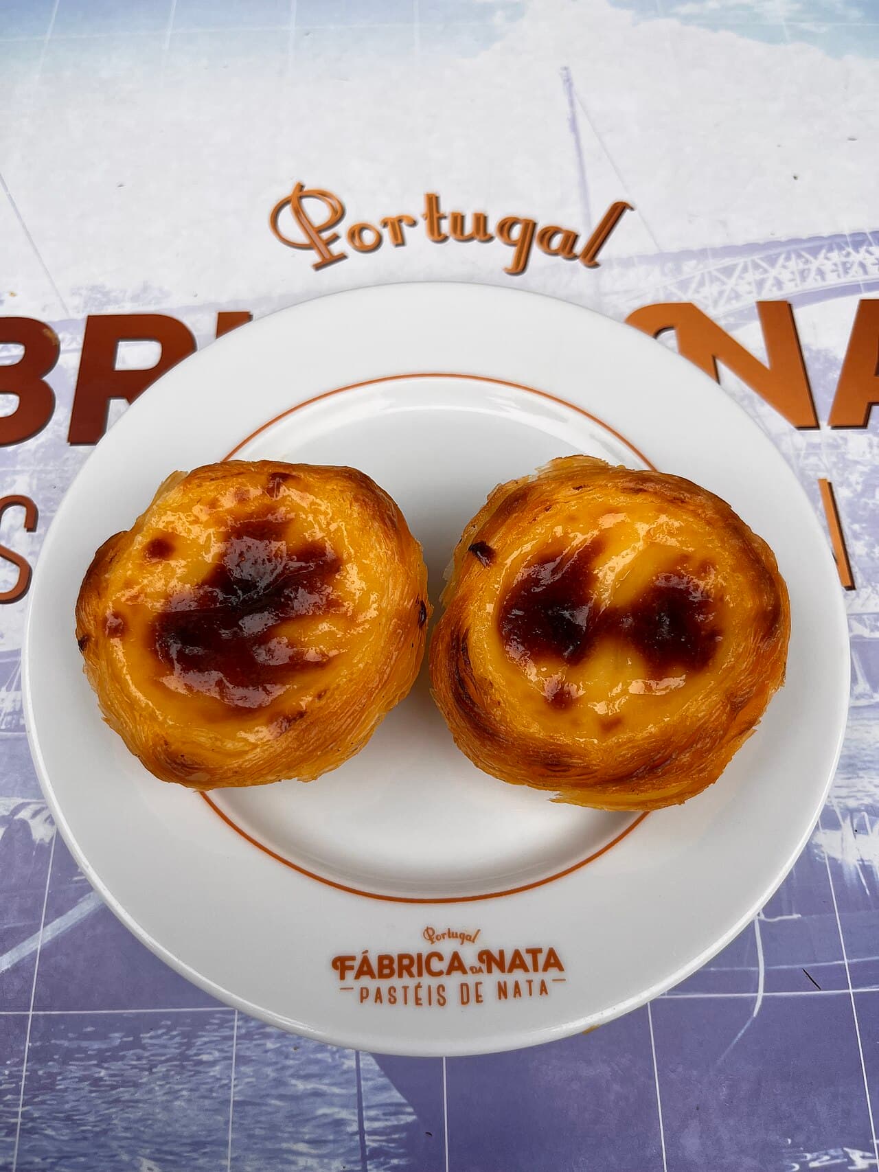 Freshly baked pastéis de nata custard tarts with caramelised tops