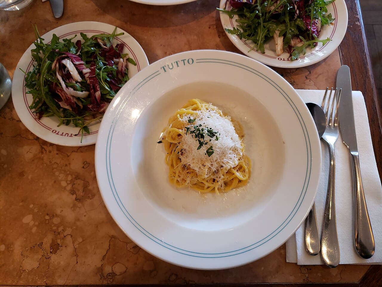 A plate of cacio e pepe pasta, a classic Roman dish