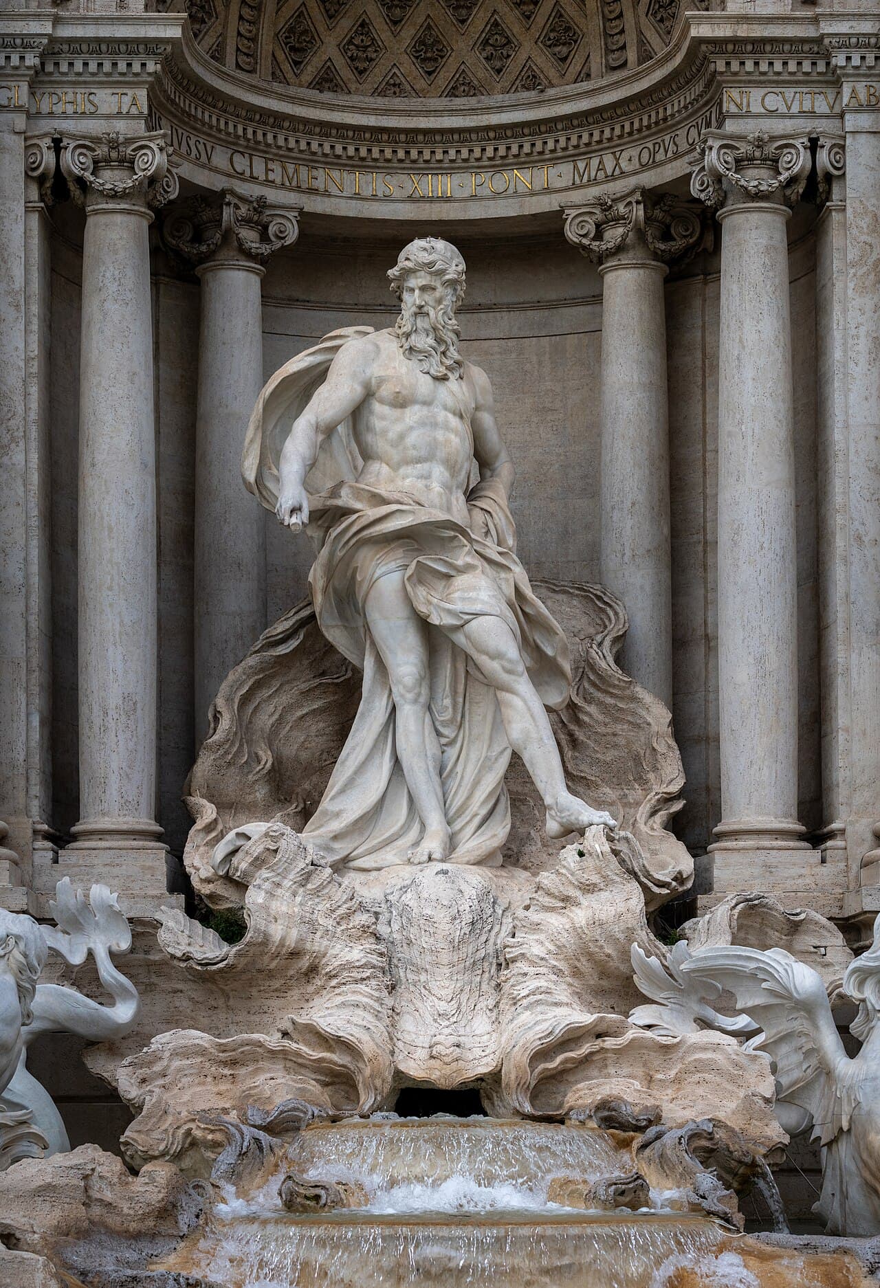 The sculpted Baroque figures and cascading water of the Trevi Fountain, Rome