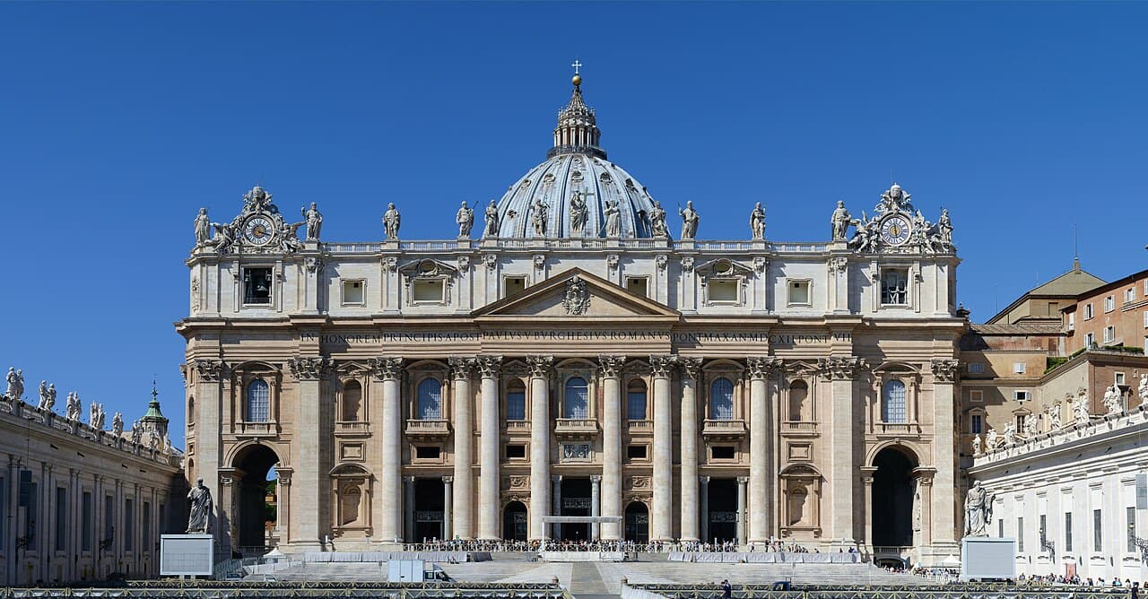 The dome and façade of St Peter's Basilica above St Peter's Square, Vatican City